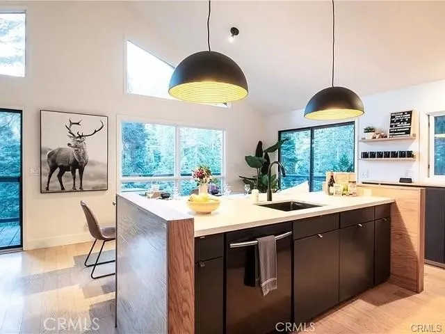 a kitchen with a sink and a stove