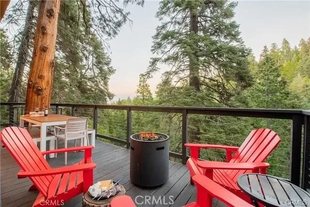 a view of a chairs and table in the balcony
