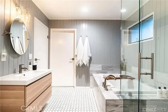 a bathroom with a double vanity sink mirror and double
