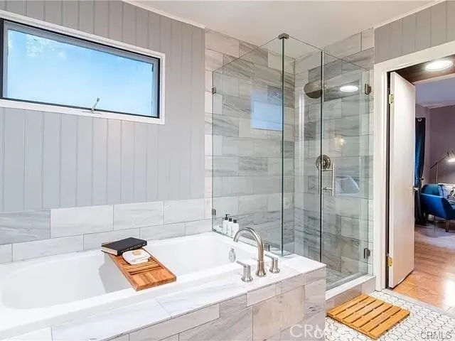 a bathroom with a tub and sink