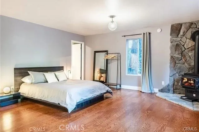 a bedroom with a bed and a view of bedroom