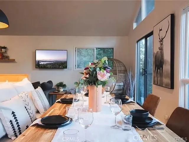 a living room with furniture fireplace and flat screen tv