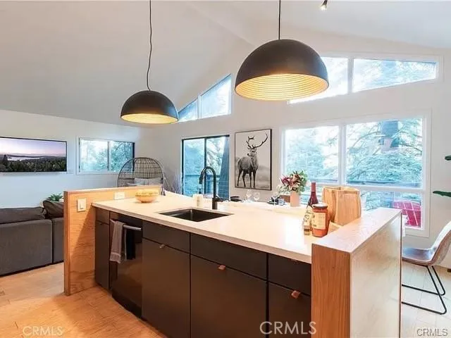 a kitchen with a stove and a large window