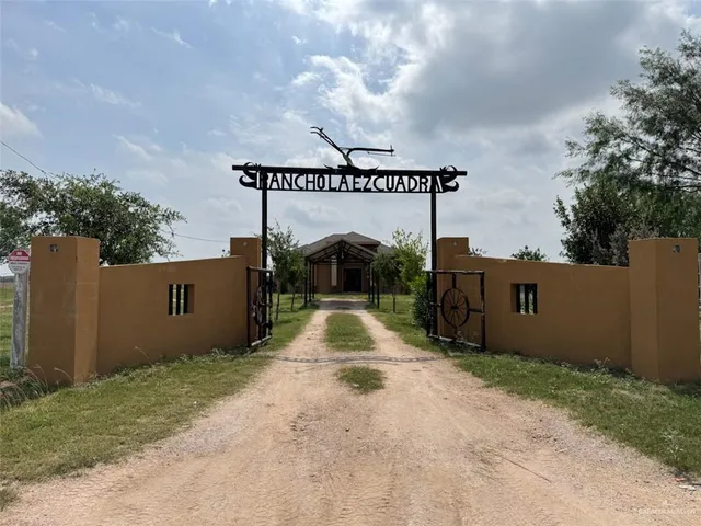 an aerial view of a house with garden space and outdoor seating