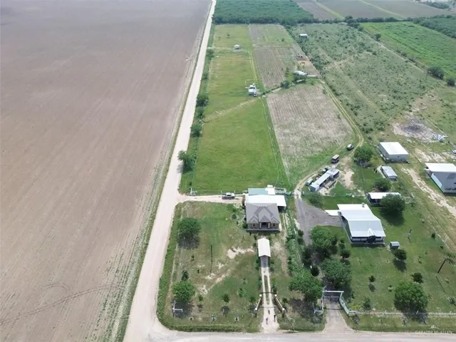 an aerial view of a residential houses with outdoor space