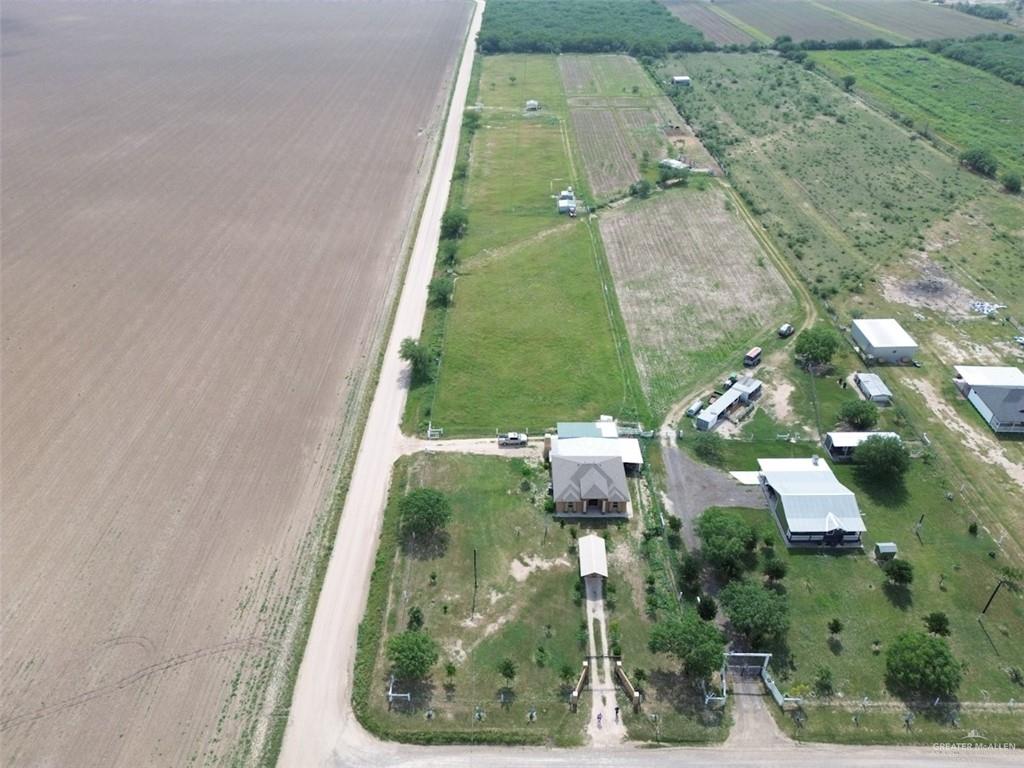 23960 North Texan Road Edinburg, TX 78541 - Photo 5 of 31 an aerial view of a residential houses with outdoor space