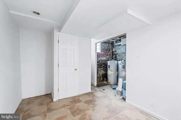 a view of a storage & utility room with closet