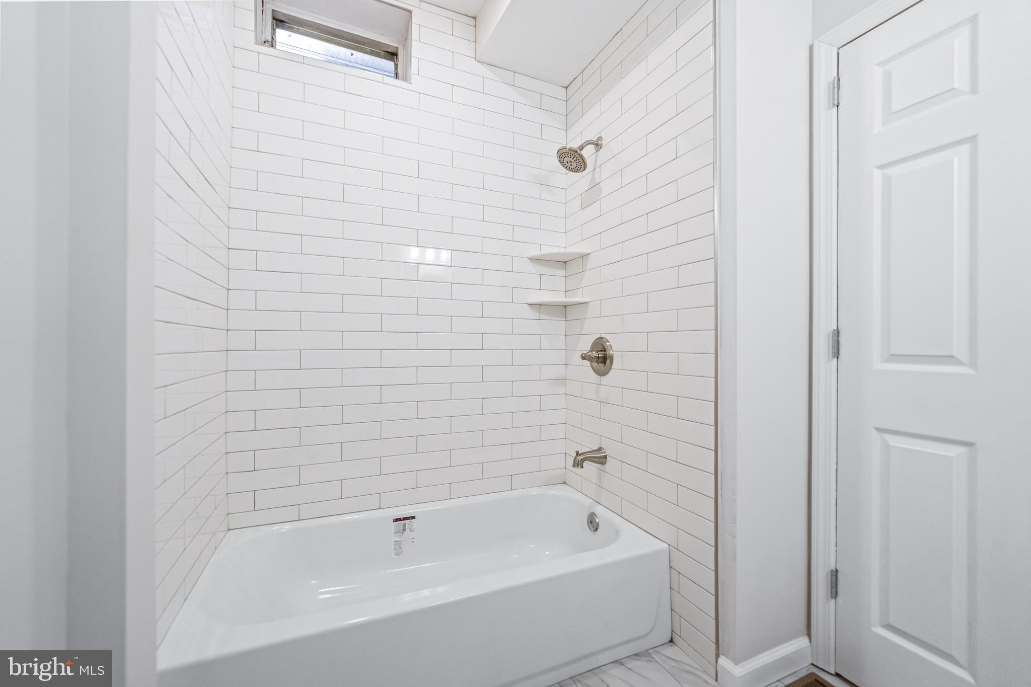 2303 Christian Street, Unit 1 Philadelphia, PA 19146 - Photo 9 of 21 a bathroom with a bathtub