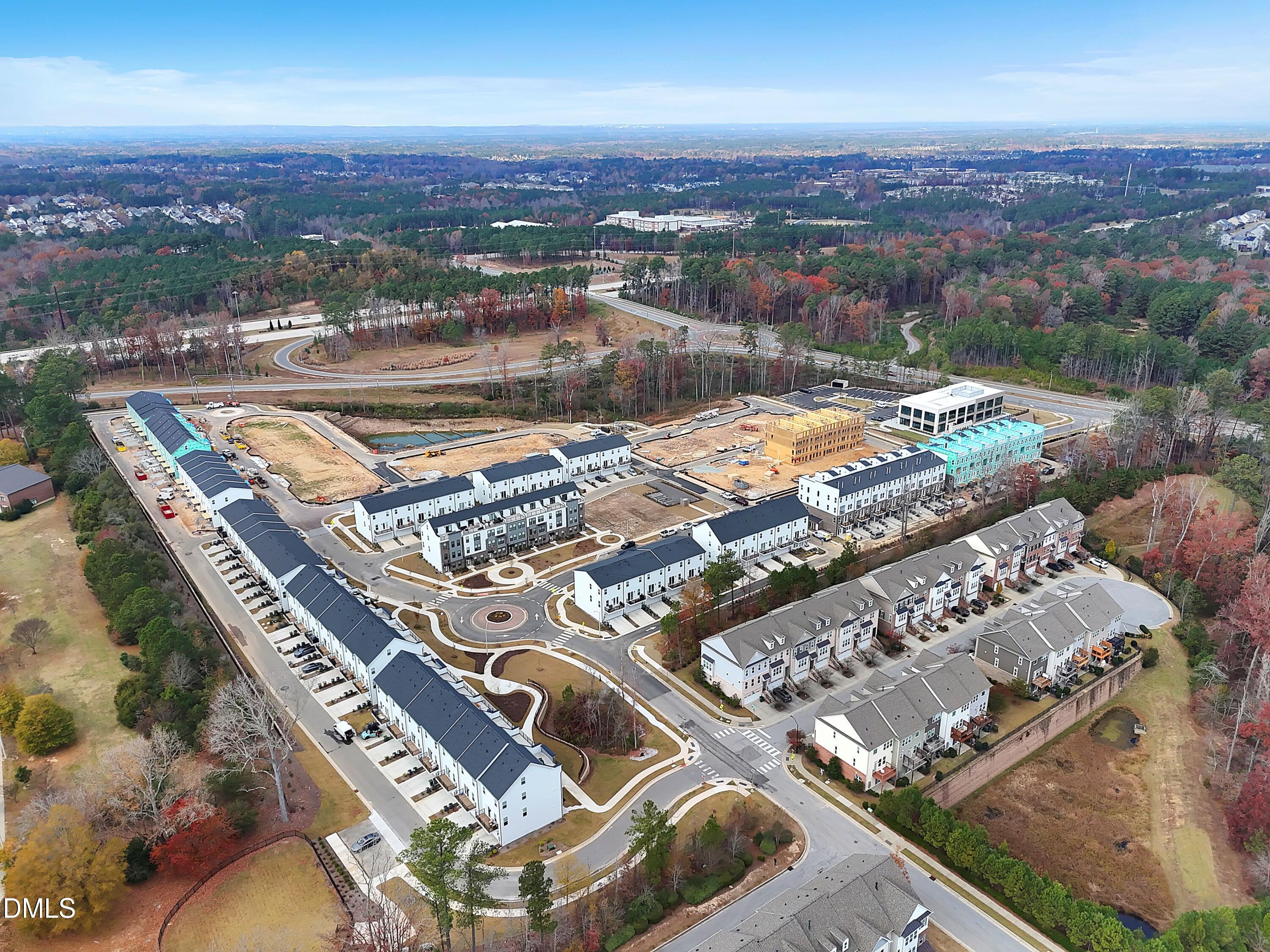 620 Hedrick Ridge Road, Unit 112 Cary, NC 27519 - Photo 27 of 34 an aerial view of residential houses with outdoor space