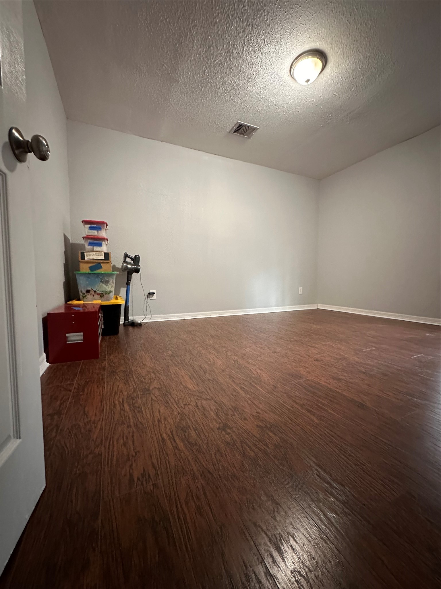 4802 Eppes Street Houston, TX 77021 - Photo 24 of 34 an empty room with wooden floor and furniture