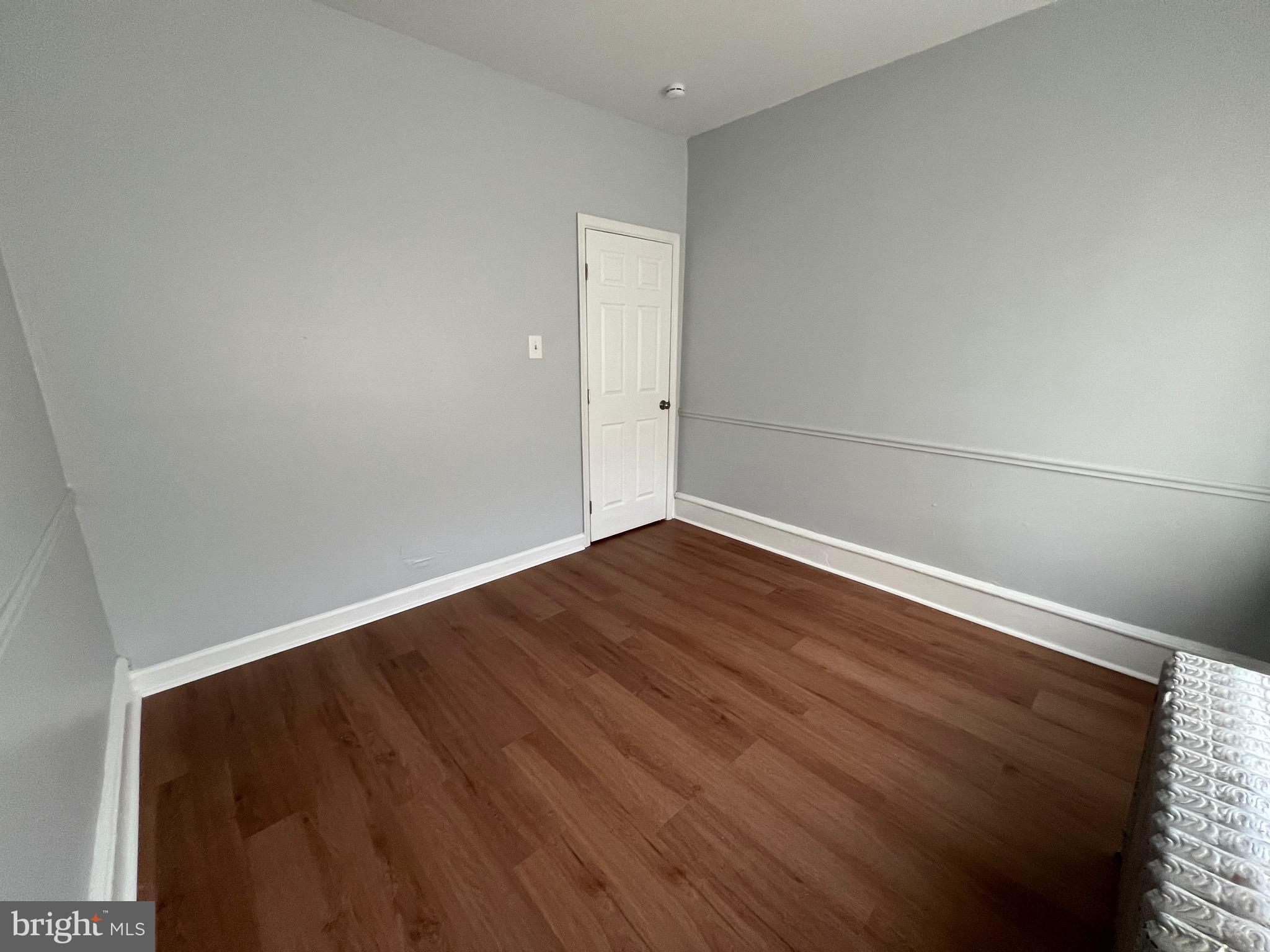 5533 Walnut Street, Unit 2 Philadelphia, PA 19139 - Photo 18 of 23 an empty room with wooden floor