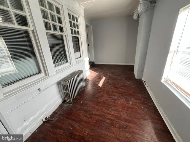 a view of staircase with wooden floor and stairs