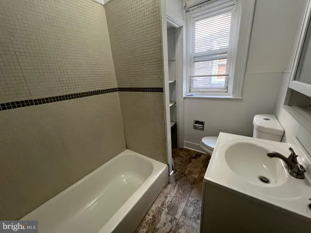 a bathroom with a sink and a bathtub