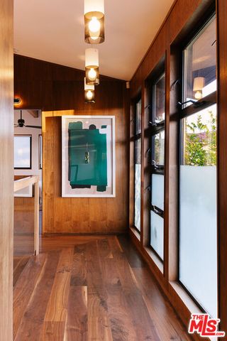 a view of a hallway with seating area