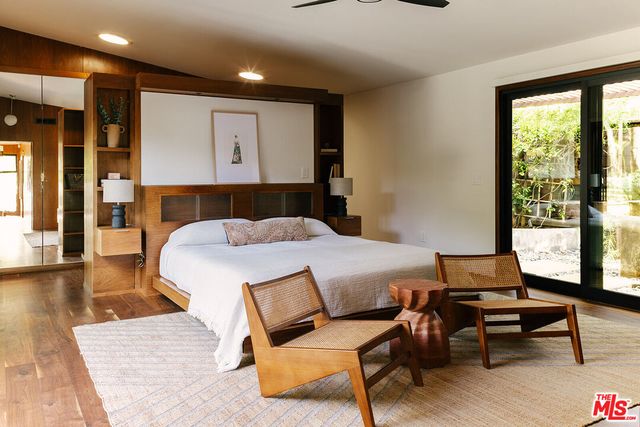 a spacious bathroom with a tub shower and sink