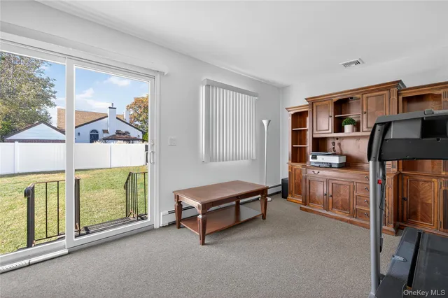 a living room with furniture pool table and a fireplace
