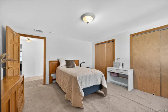 a bedroom with a bed and a cabinets