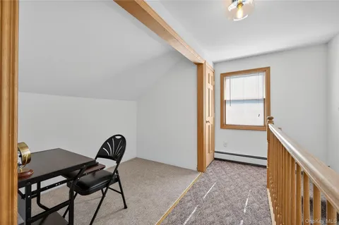 a backyard of a house with outdoor seating