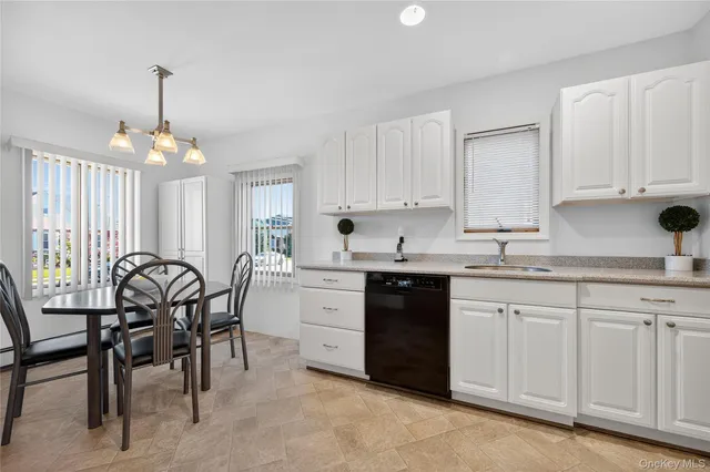 a kitchen that has a cabinets counter space and a sink