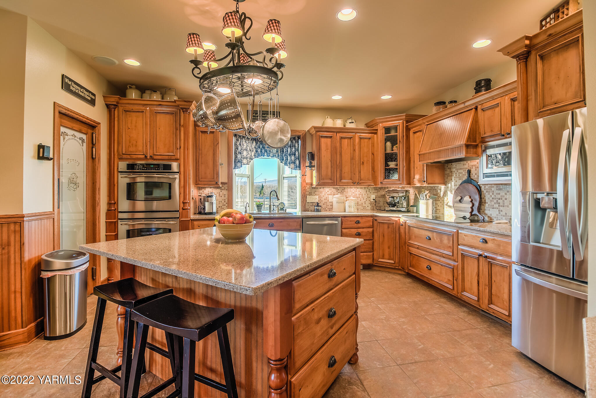 11392 Zier Road Yakima, WA 98908 - Photo 11 of 47 a kitchen with stainless steel appliances granite countertop a sink a stove and a refrigerator
