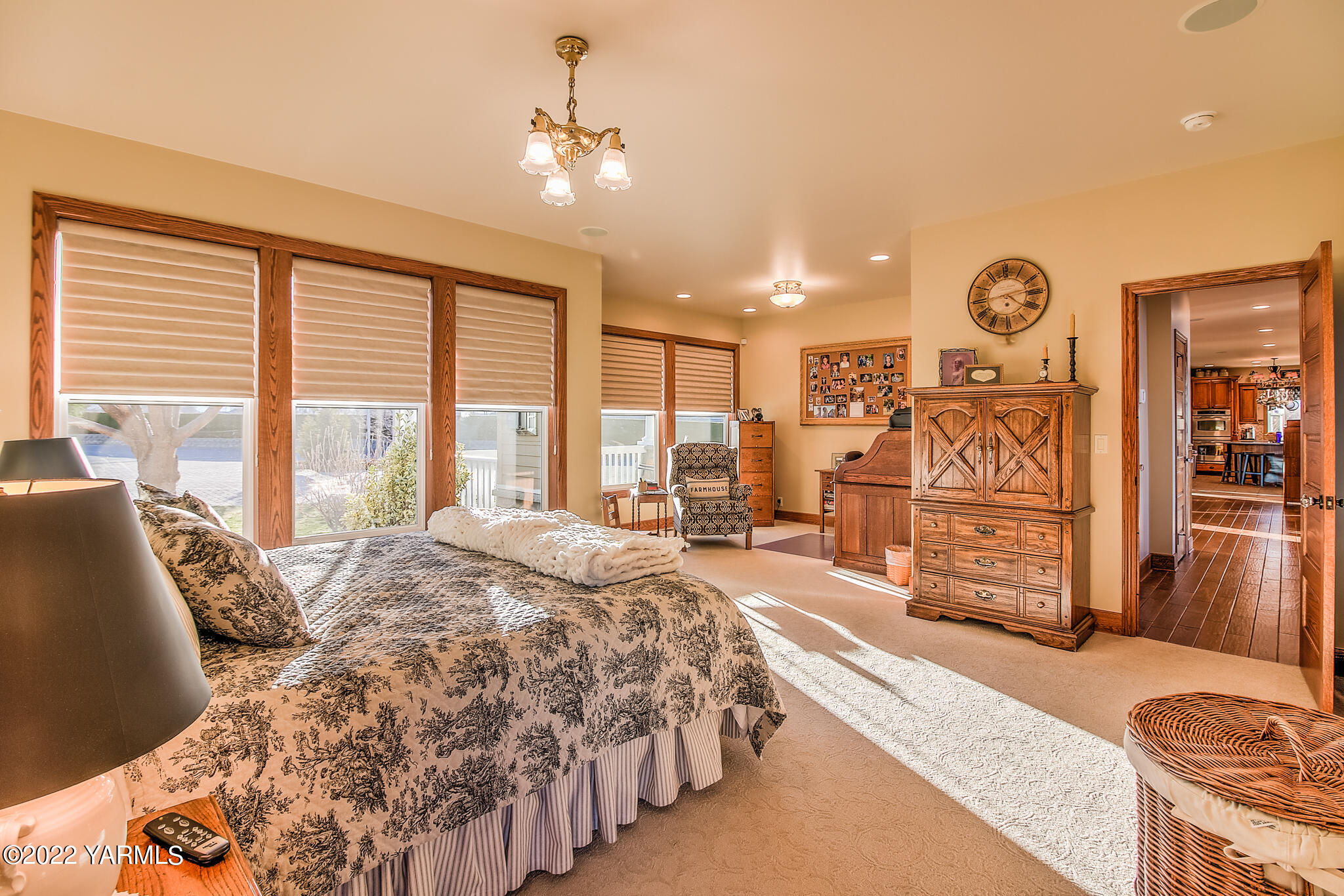 11392 Zier Road Yakima, WA 98908 - Photo 16 of 47 a spacious bedroom with a bed a dresser and large windows