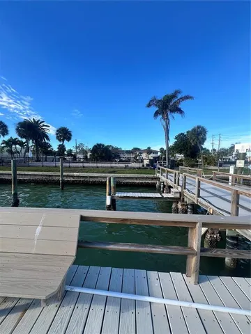 a view of a terrace with wooden floor and city view