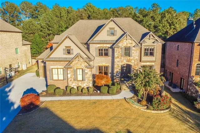 a front view of a house with a yard