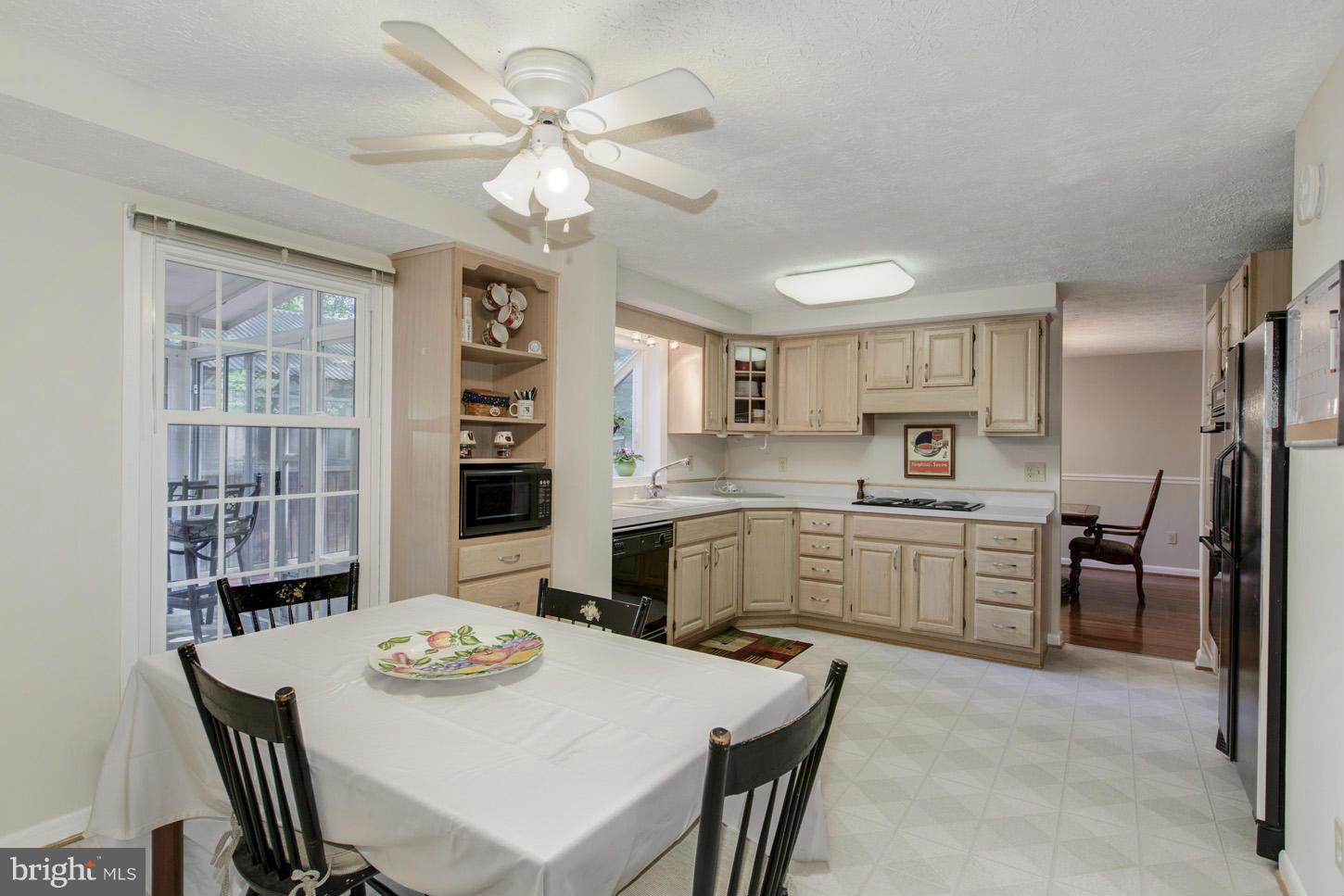5727 Heming Avenue Springfield, VA 22151 - Photo 14 of 30 a kitchen that has a table and chairs in it