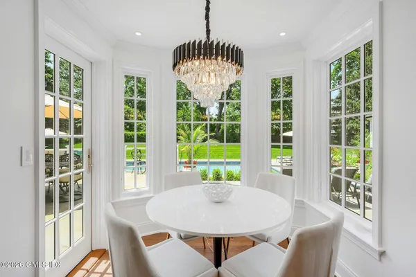 a view of a dining room with furniture window and outside view
