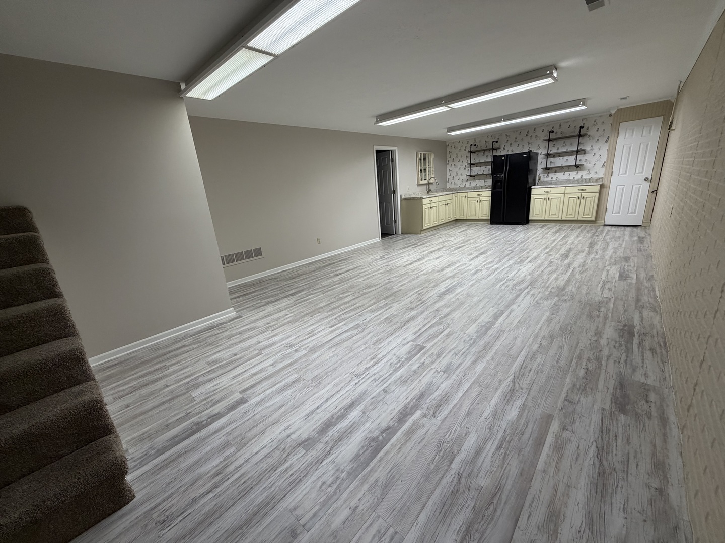 1867 Gragg Street Centralia, IL 62801 - Photo 23 of 30 a view of a big room with wooden floor and stairs