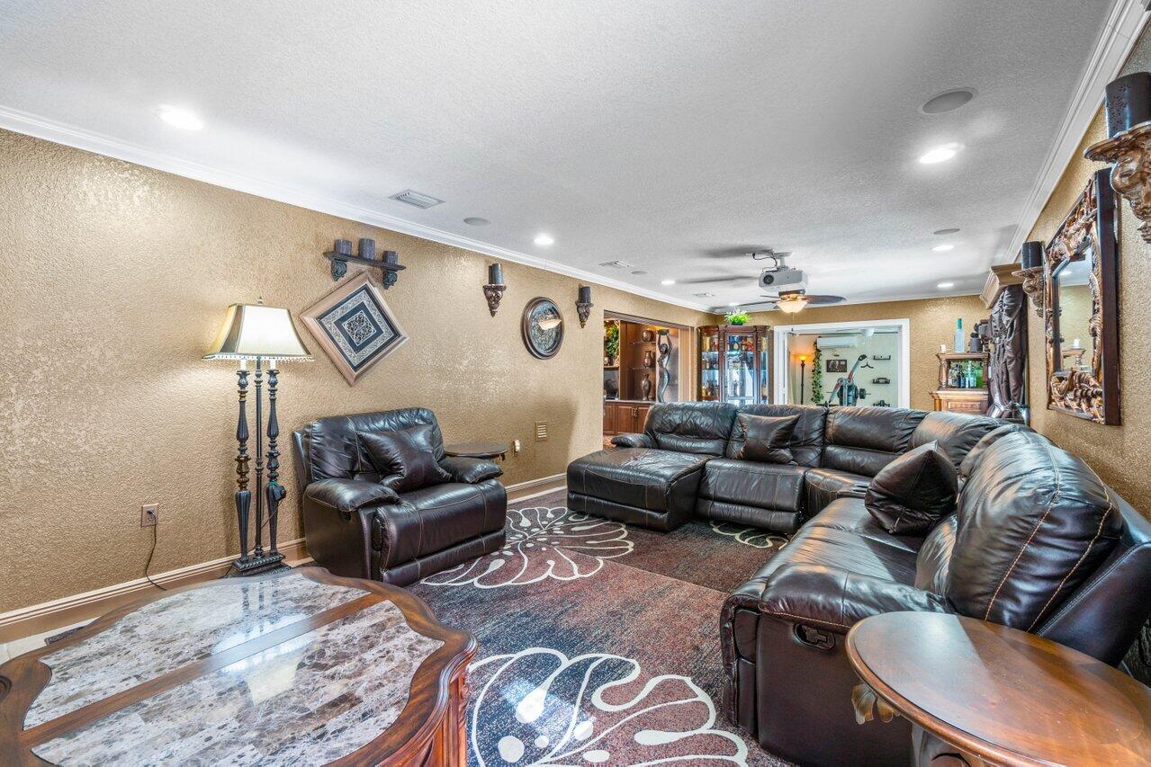 294 Northwest 69th Street Boca Raton, FL 33487 - Photo 15 of 39 a living room with furniture and a window
