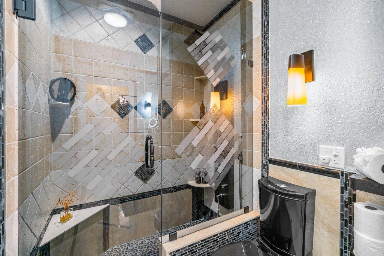 294 Northwest 69th Street Boca Raton, FL 33487 - Photo 26 of 39 a kitchen with a sink and stainless steel appliances