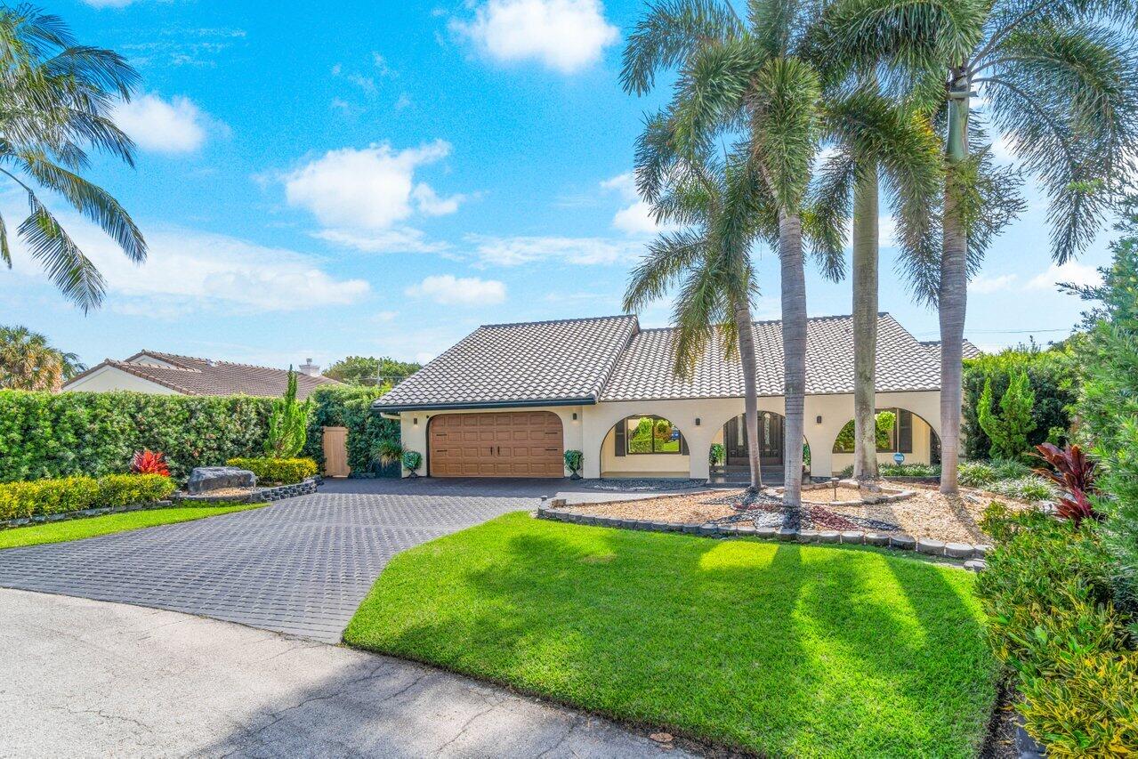 294 Northwest 69th Street Boca Raton, FL 33487 - Photo 3 of 39 a view of a house with a yard