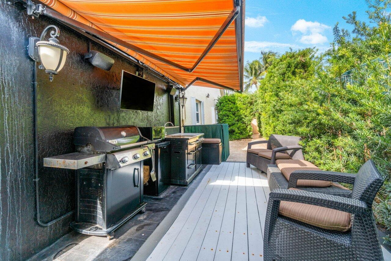 294 Northwest 69th Street Boca Raton, FL 33487 - Photo 31 of 39 a view of a chairs and table on the wooden floor