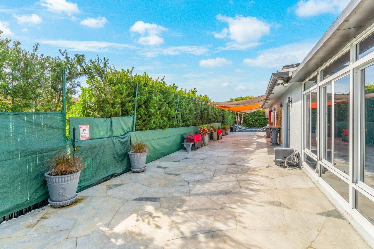 294 Northwest 69th Street Boca Raton, FL 33487 - Photo 35 of 39 a view of a backyard with sitting area