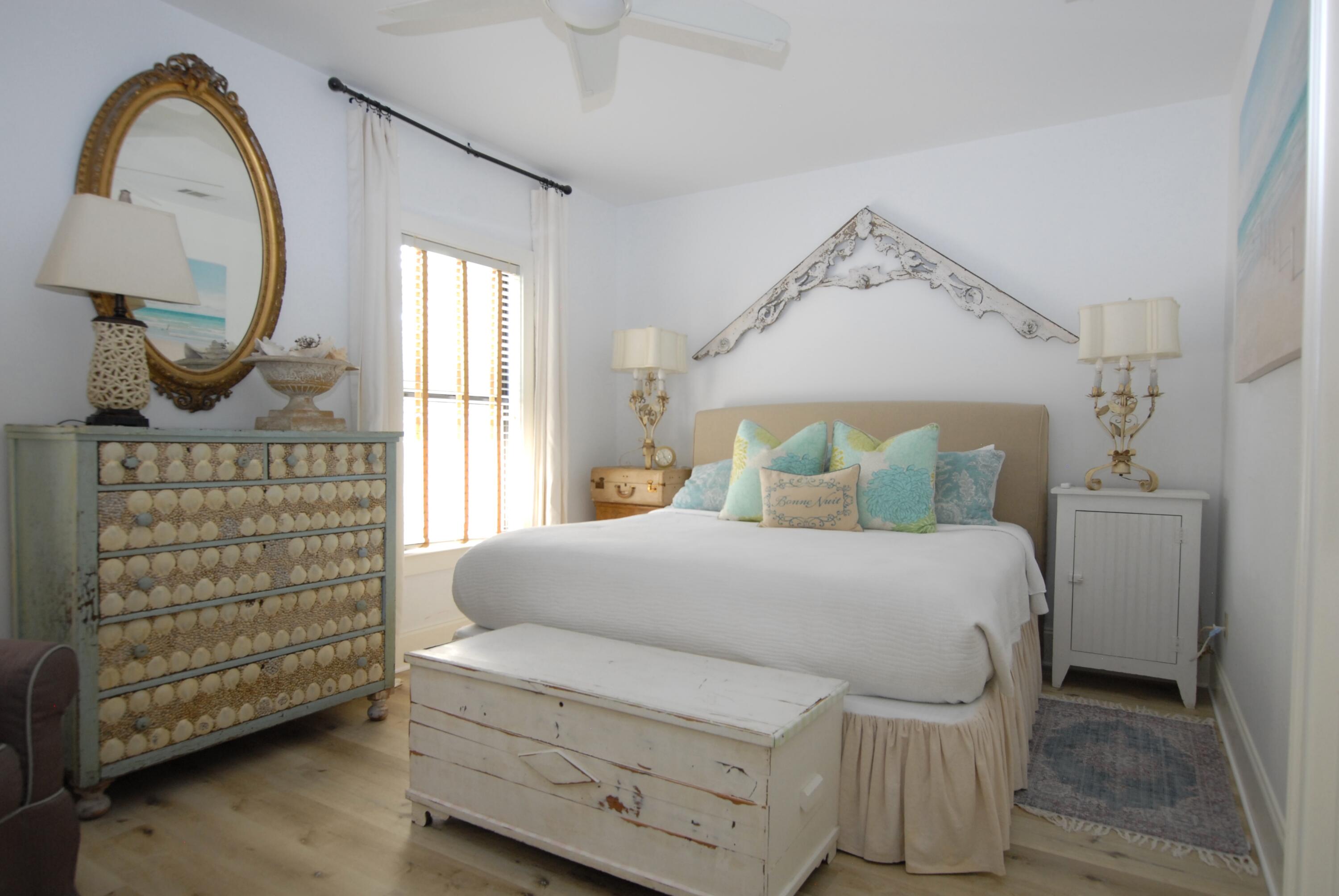 16 Kingfish Street Santa Rosa Beach, FL 32459 - Photo 11 of 21 a bedroom with a bed a mirror on the dresser and a window