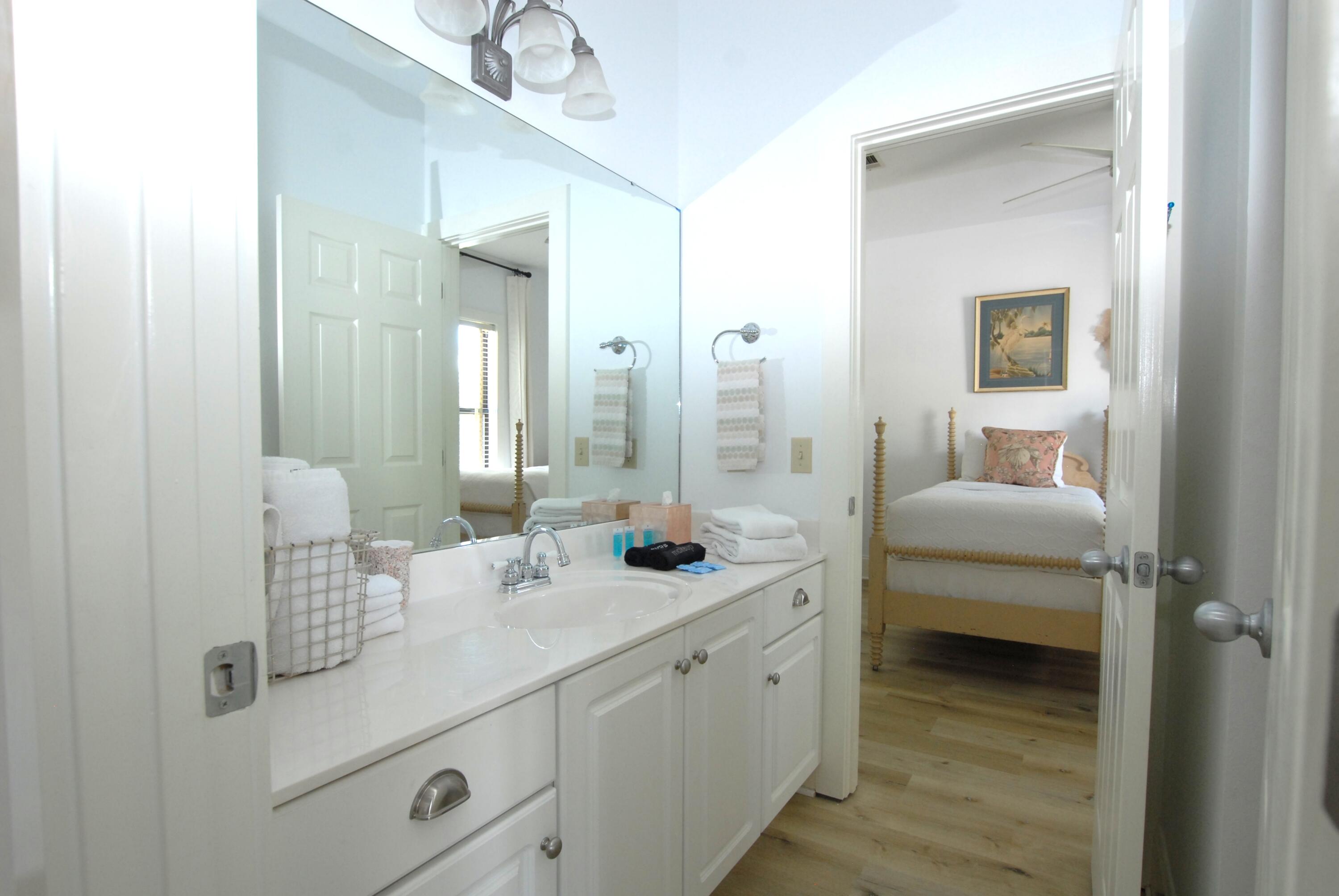 16 Kingfish Street Santa Rosa Beach, FL 32459 - Photo 16 of 21 a en suite bathroom with double sink and a mirror