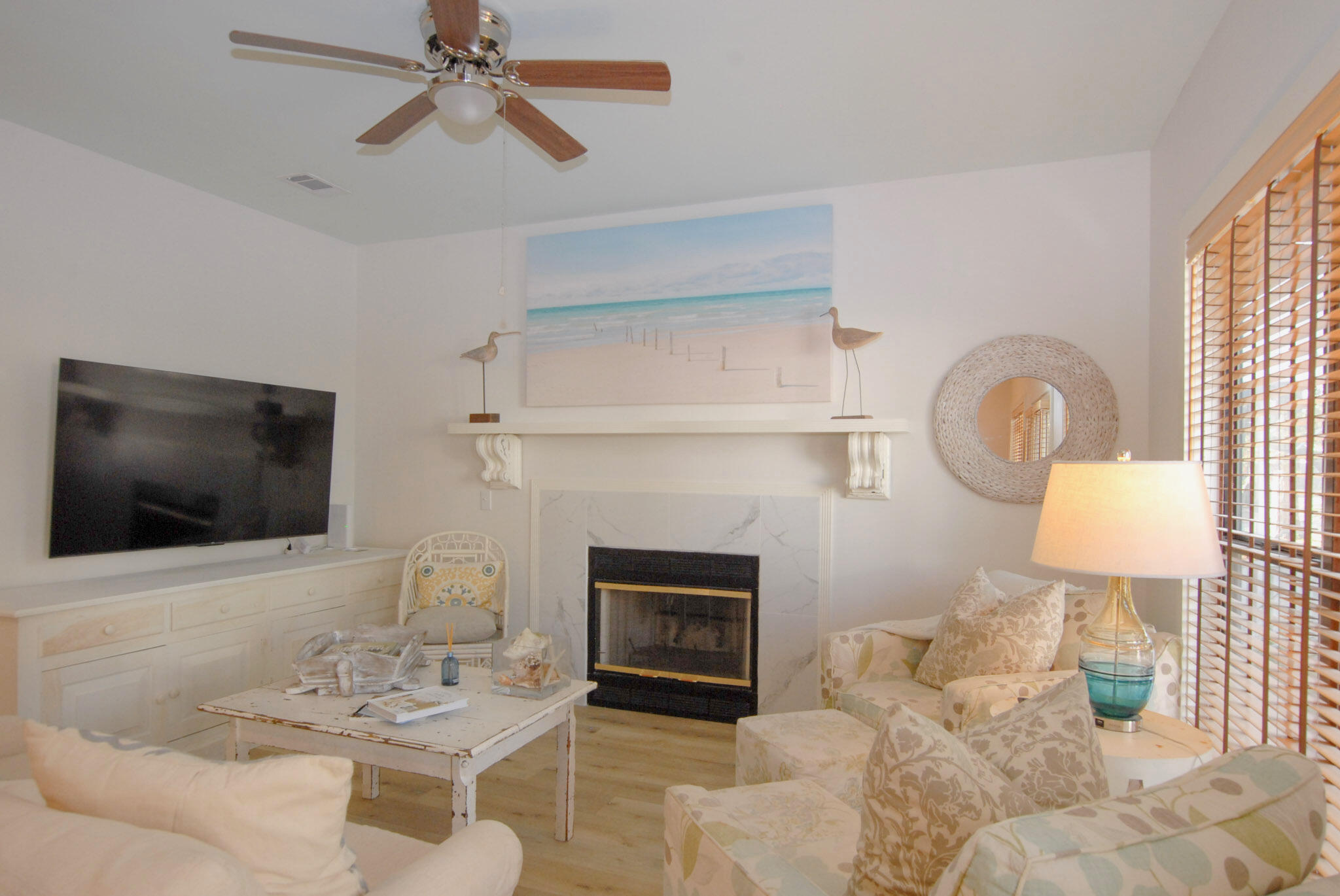 16 Kingfish Street Santa Rosa Beach, FL 32459 - Photo 5 of 21 a living room with furniture a fireplace and a flat screen tv