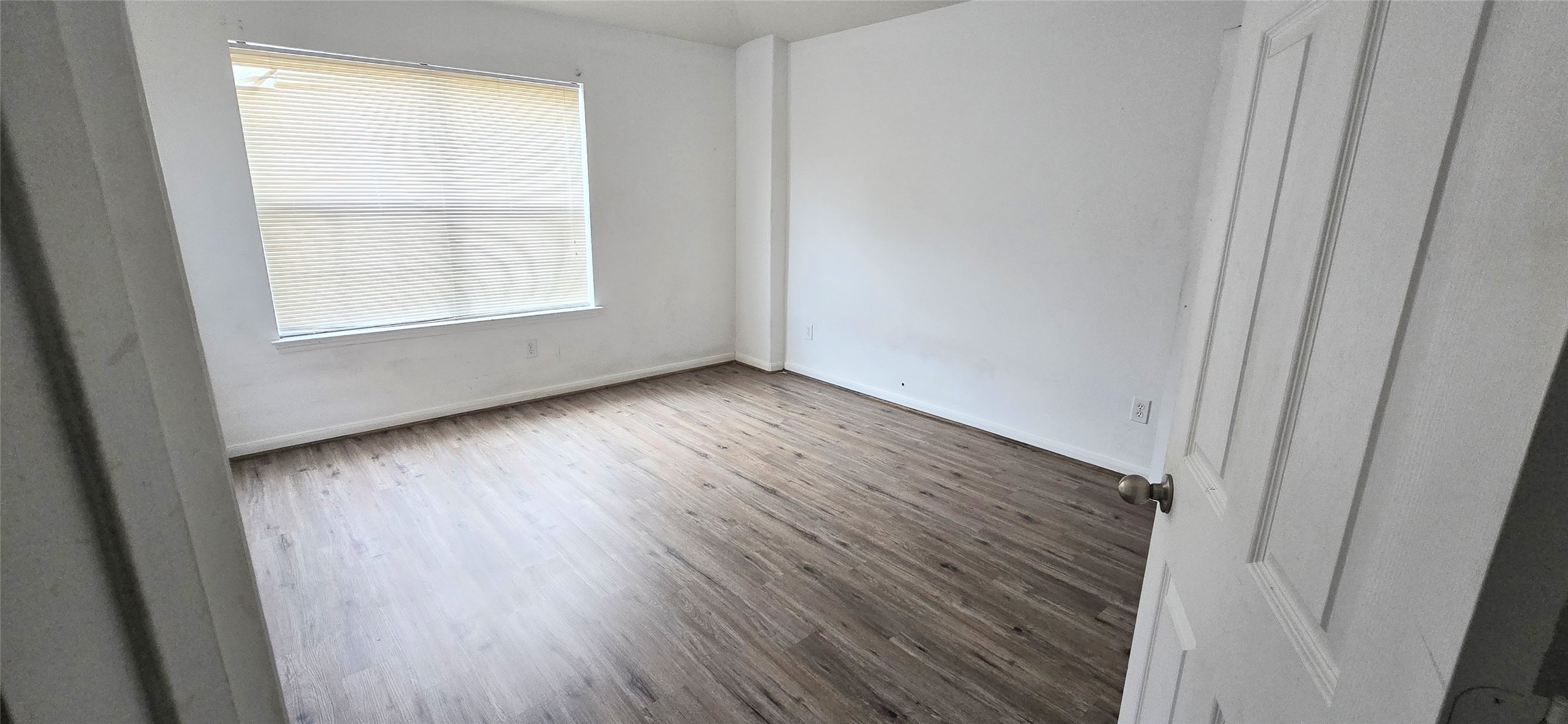 23526 Whispering Maple Drive Spring, TX 77373 - Photo 12 of 23 an empty room with wooden floor and windows