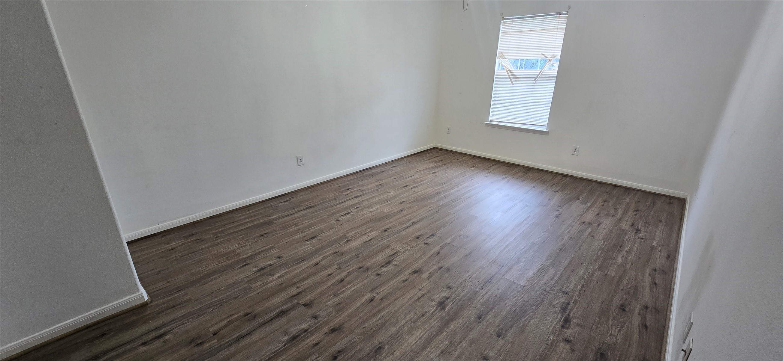 23526 Whispering Maple Drive Spring, TX 77373 - Photo 17 of 23 an empty room with wooden floor and windows