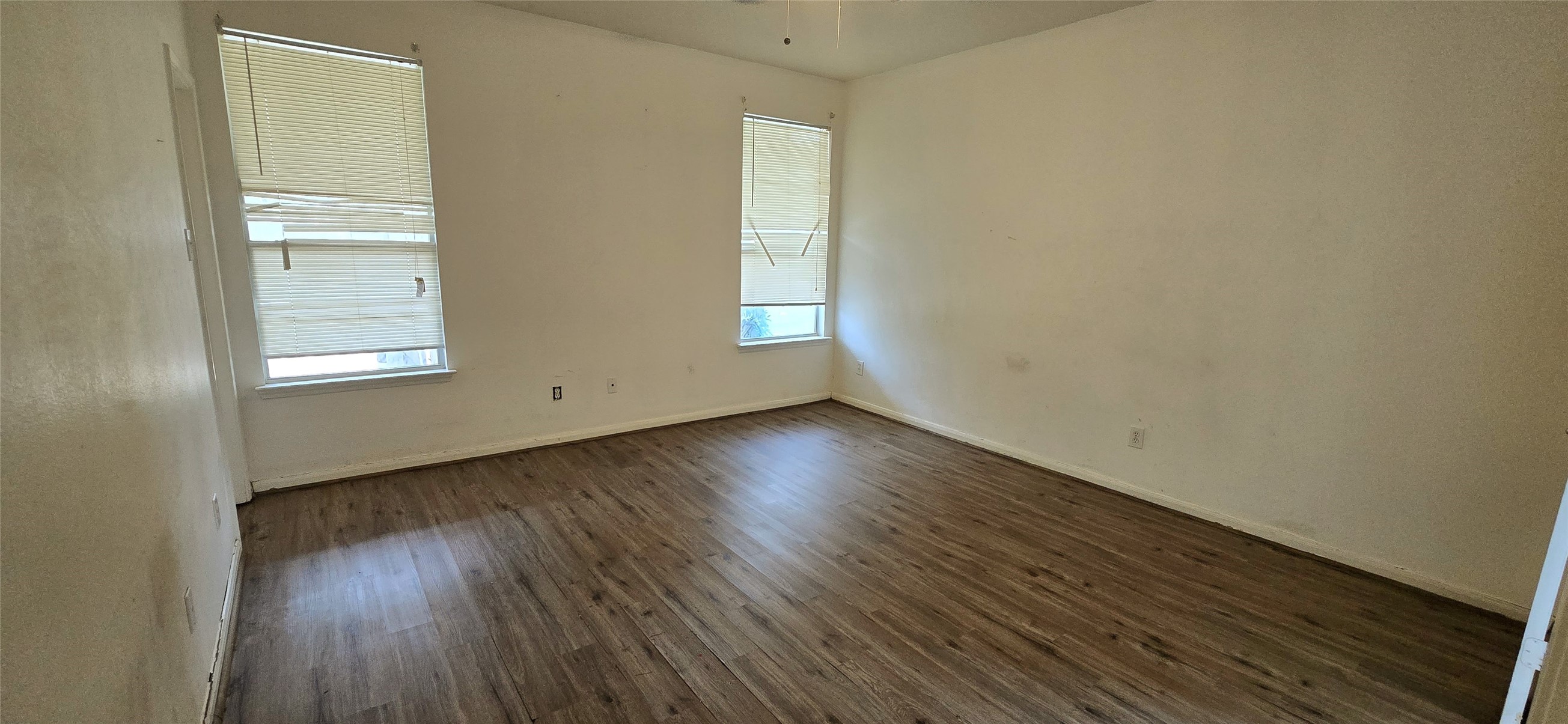 23526 Whispering Maple Drive Spring, TX 77373 - Photo 18 of 23 an empty room with wooden floor and windows