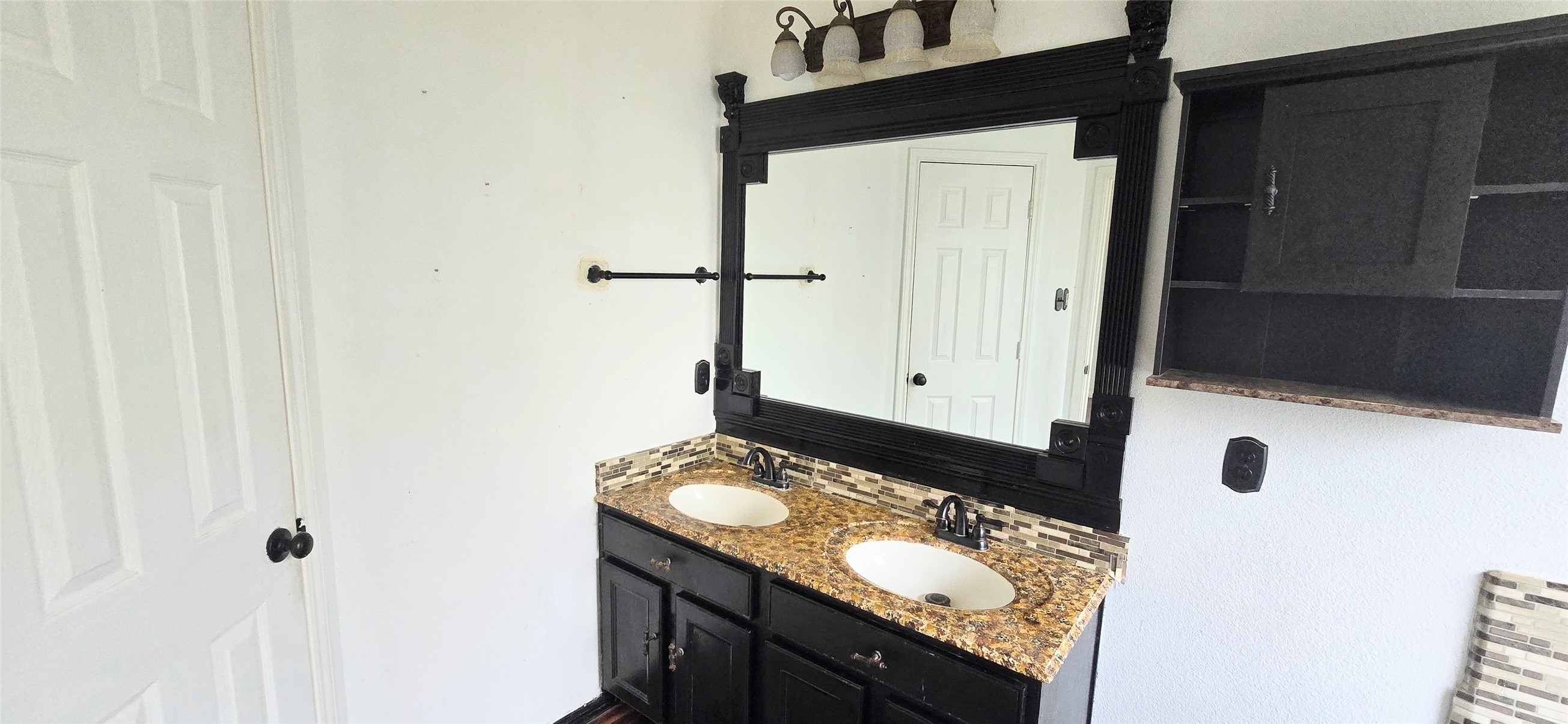 23526 Whispering Maple Drive Spring, TX 77373 - Photo 19 of 23 a bathroom with a granite countertop sink and a mirror