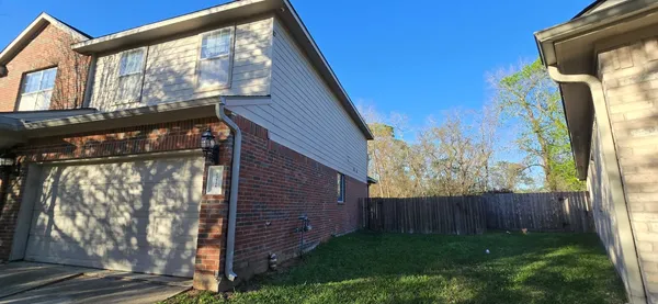 a view of a house with a tree