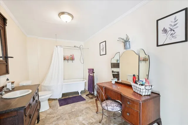 a living room with furniture and a mirror