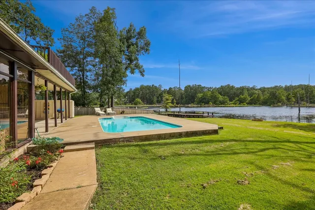 a view of swimming pool with outdoor space and seating area