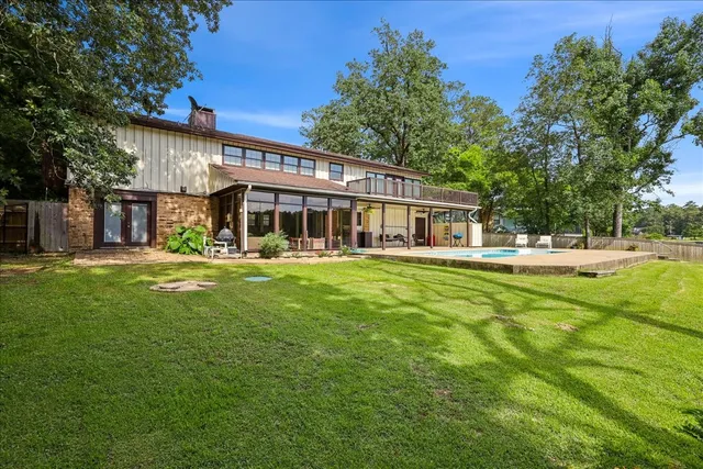 a front view of a house with a yard table and chairs