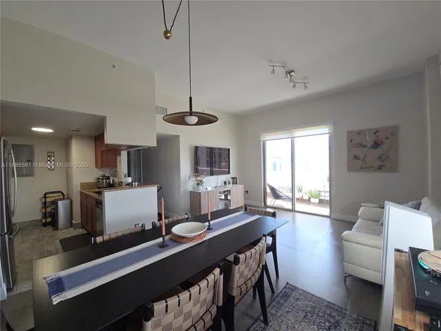 a kitchen with a stove a sink and a refrigerator