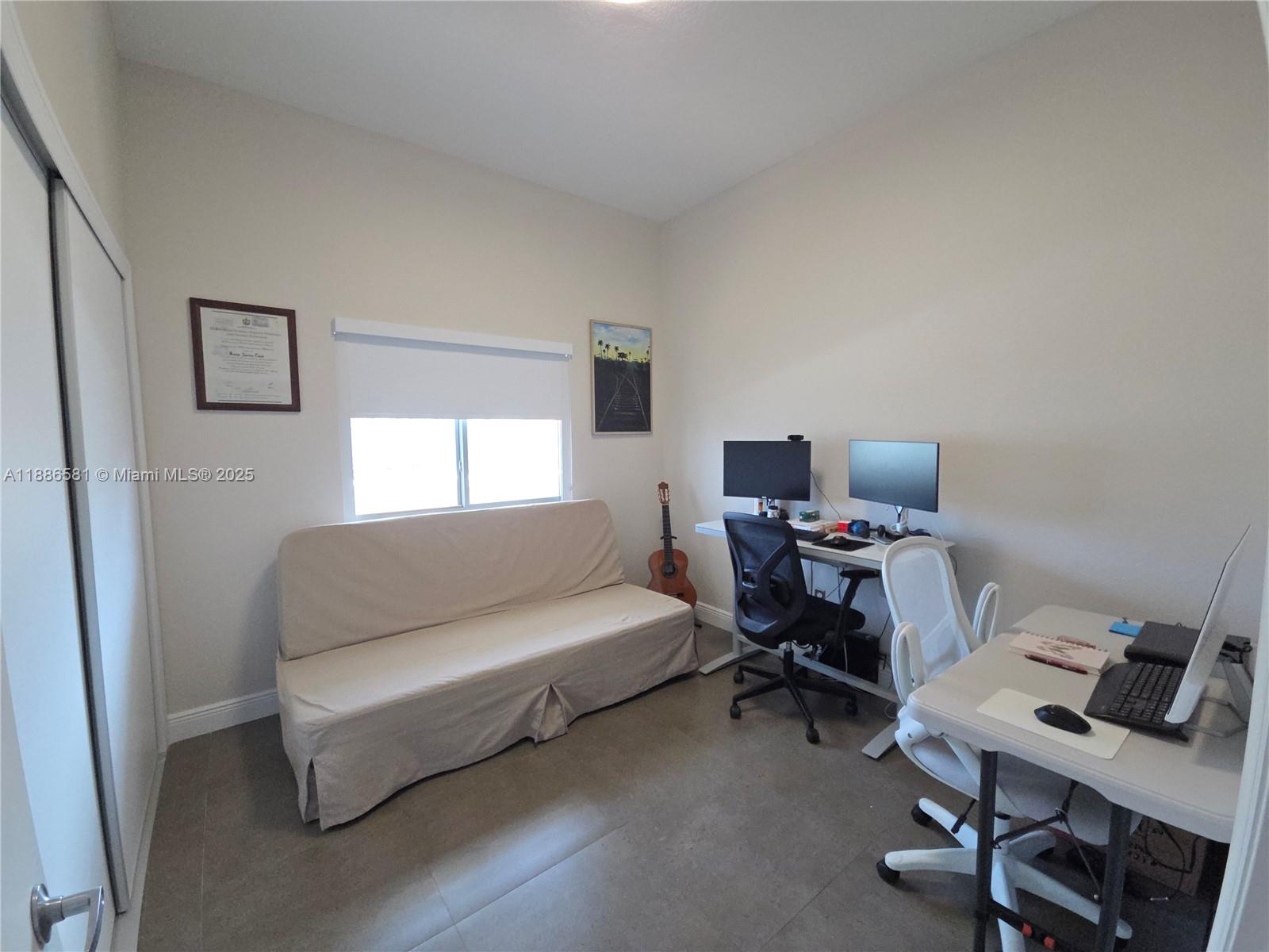 36 Northwest 6th Avenue, Unit TS9 Miami, FL 33128 - Photo 23 of 50 a bedroom with a workspace