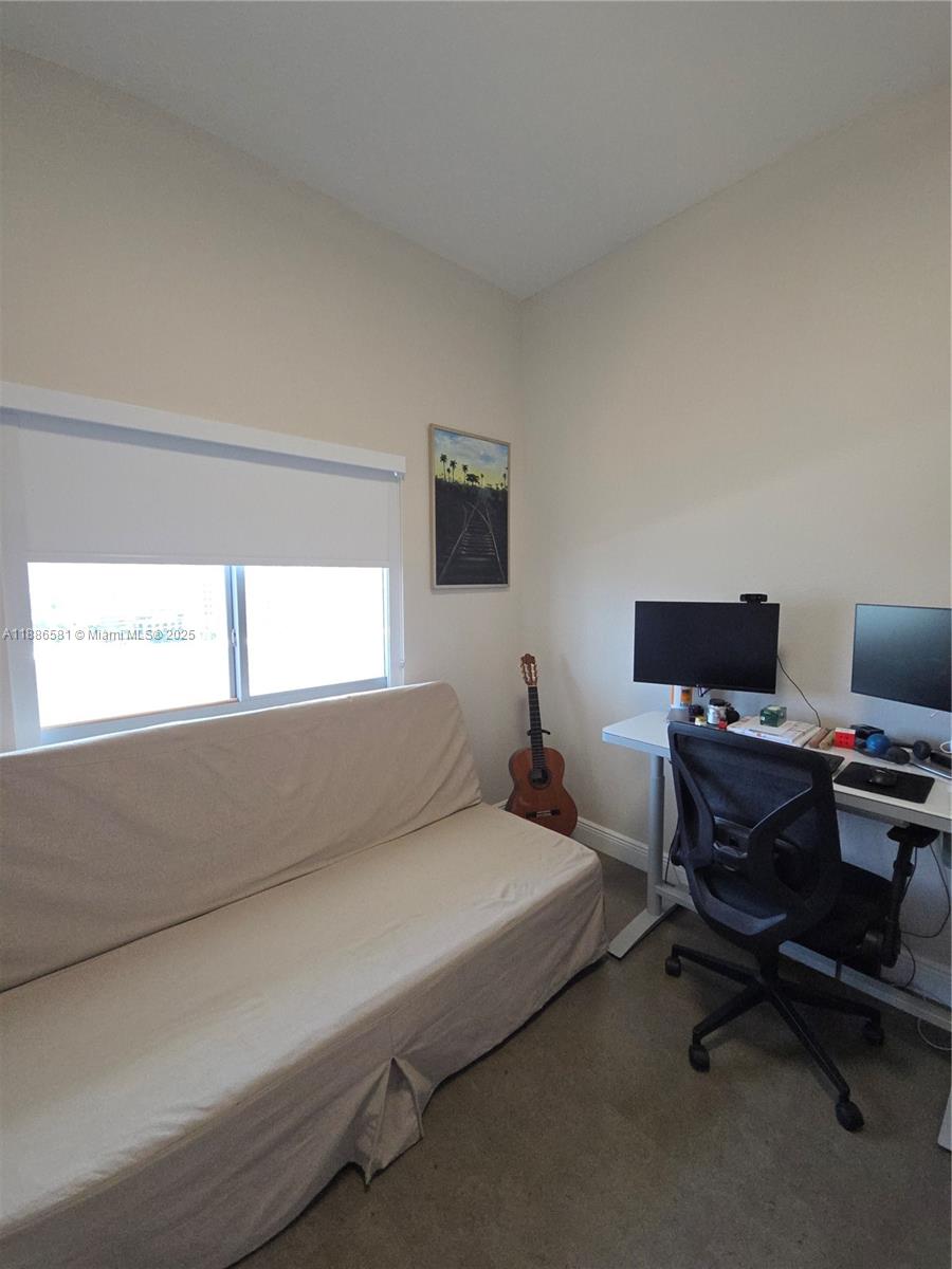 36 Northwest 6th Avenue, Unit TS9 Miami, FL 33128 - Photo 25 of 50 a bedroom with a bed and a desk