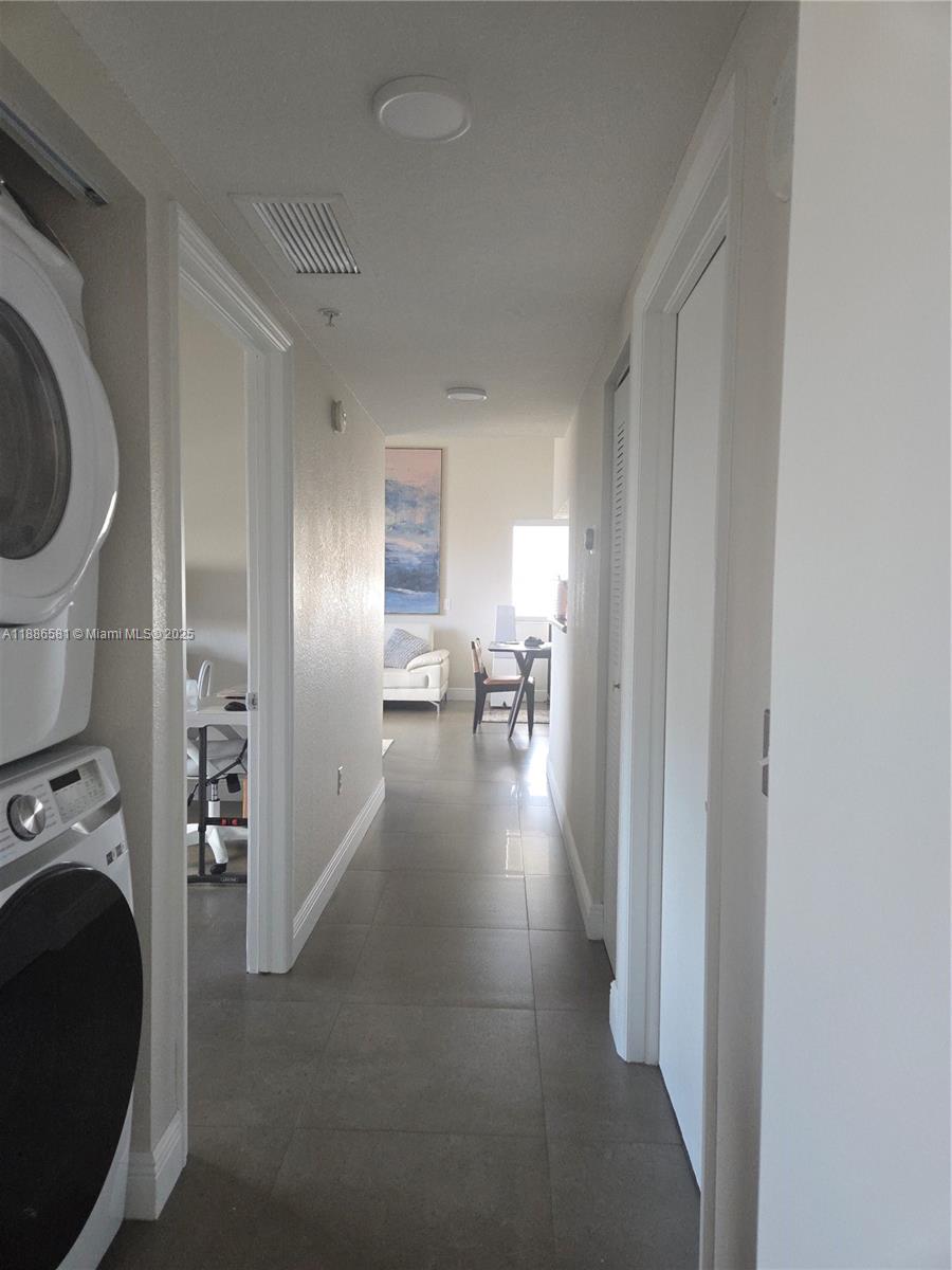 36 Northwest 6th Avenue, Unit TS9 Miami, FL 33128 - Photo 29 of 50 a view of a hallway with washer and dryer